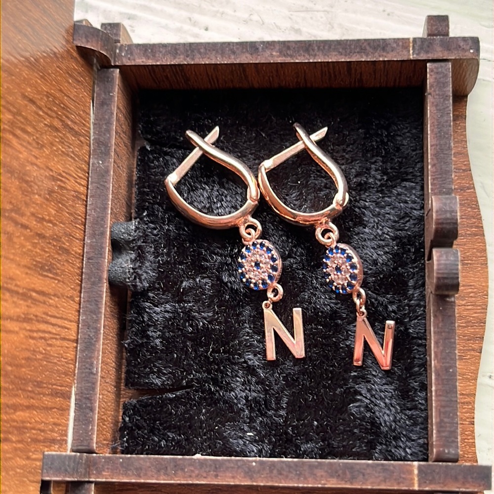 Evil eye N initial earrings